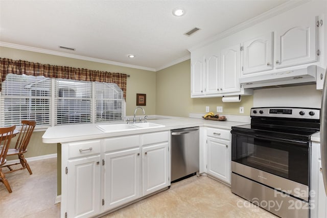 101 Citation Ln, Gastonia, NC 28056 - kitchen featuring appliances with stainless steel finishes, under cabinet range hood, a peninsula, crown molding, and white cabinets