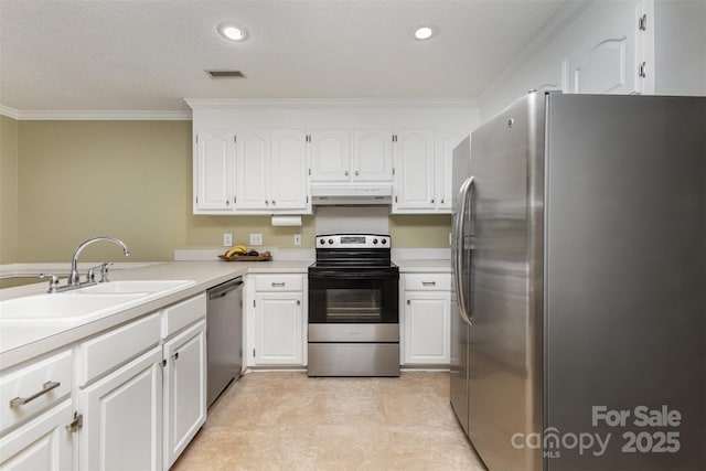 101 Citation Ln, Gastonia, NC 28056 - kitchen featuring appliances with stainless steel finishes, under cabinet range hood, ornamental molding, white cabinetry, and light countertops