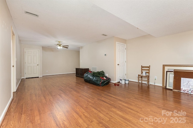 101 Citation Ln, Gastonia, NC 28056 - sitting room featuring wood finished floors, a ceiling fan, and a textured ceiling