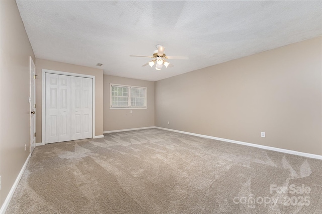 101 Citation Ln, Gastonia, NC 28056 - unfurnished bedroom featuring carpet, a closet, a textured ceiling, and ceiling fan
