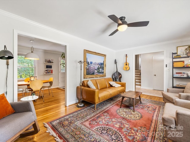 3200 Spring Valley Rd, Charlotte, NC 28210 - living area featuring light wood-type flooring, ornamental molding, ceiling fan, and stairway