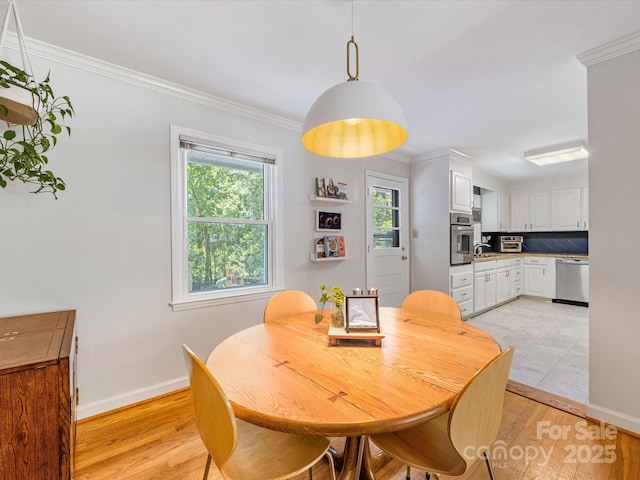 3200 Spring Valley Rd, Charlotte, NC 28210 - dining space with light wood finished floors and ornamental molding