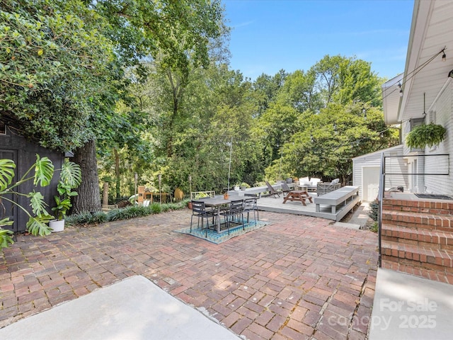 3200 Spring Valley Rd, Charlotte, NC 28210 - view of patio / terrace featuring an outdoor hangout area, outdoor dining area, and a storage shed