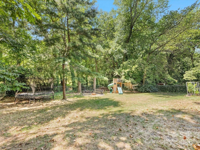 3200 Spring Valley Rd, Charlotte, NC 28210 - fenced backyard featuring a playground and a trampoline
