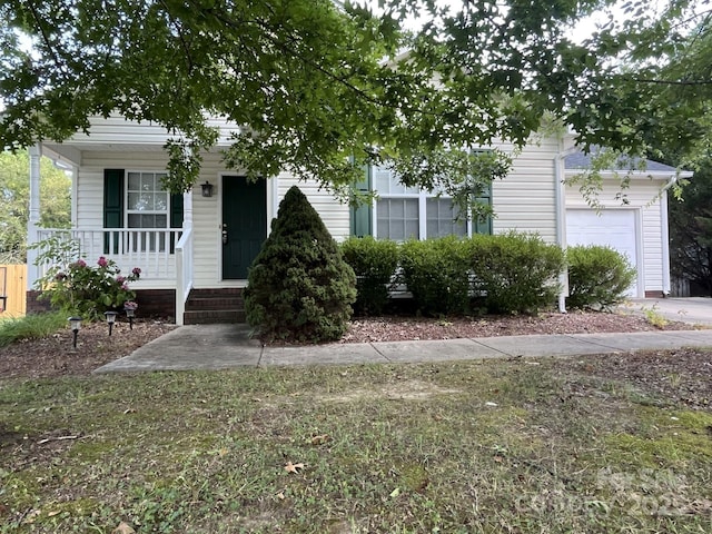 1015 Piney Church Rd, Concord, NC 28025 - view of property hidden behind natural elements with a porch and a garage