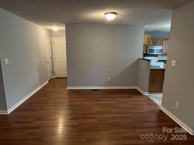 1015 Piney Church Rd, Concord, NC 28025 - unfurnished dining area featuring dark wood finished floors and a textured ceiling