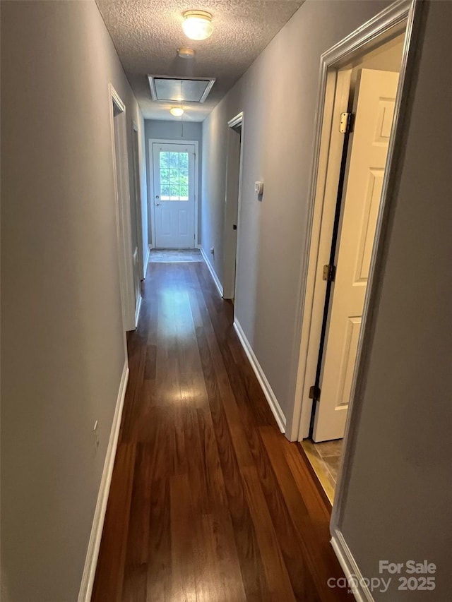 1015 Piney Church Rd, Concord, NC 28025 - hallway with a textured ceiling, dark wood finished floors, and attic access