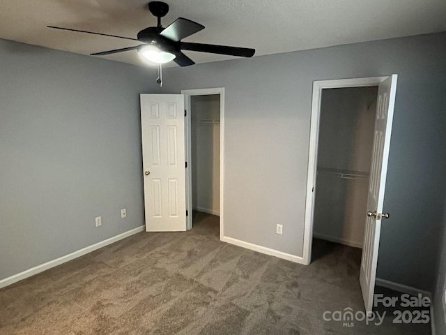 1015 Piney Church Rd, Concord, NC 28025 - unfurnished bedroom featuring carpet floors, a walk in closet, and ceiling fan