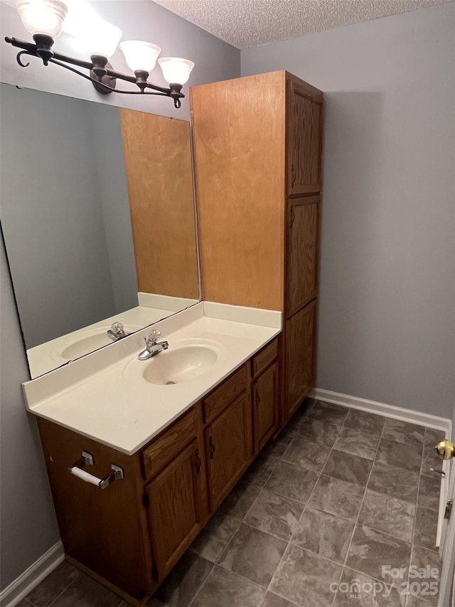 1015 Piney Church Rd, Concord, NC 28025 - bathroom with vanity, a textured ceiling, and a chandelier