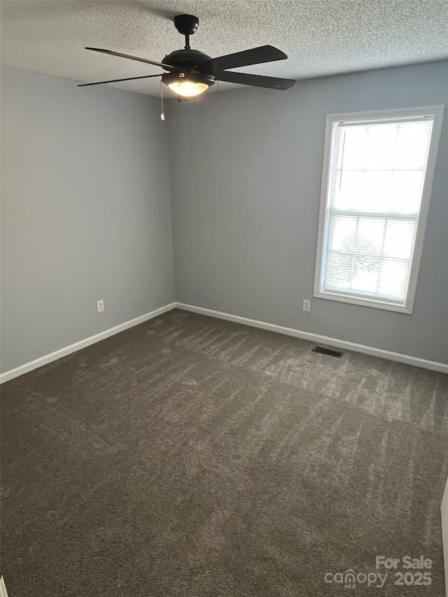 1015 Piney Church Rd, Concord, NC 28025 - empty room with ceiling fan, a textured ceiling, and dark carpet