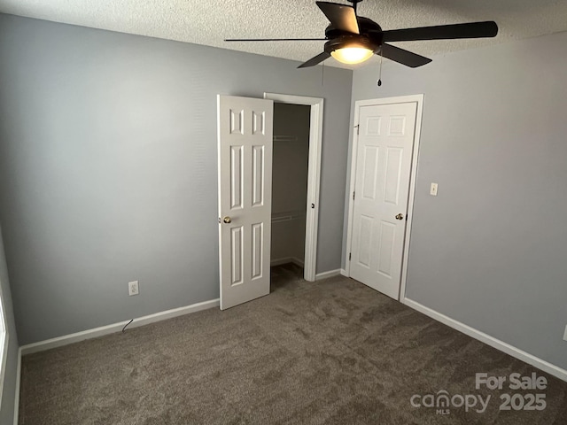 1015 Piney Church Rd, Concord, NC 28025 - unfurnished bedroom featuring carpet floors, a textured ceiling, ceiling fan, and a closet