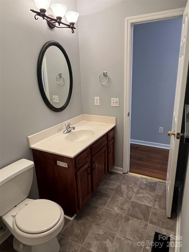 1015 Piney Church Rd, Concord, NC 28025 - half bath featuring vanity, a chandelier, and tile patterned flooring