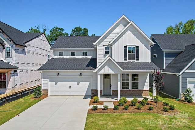 9511 Coast Laurel Ave NW, Concord, NC 28027 - view of front of property with board and batten siding, driveway, a porch, and a front yard