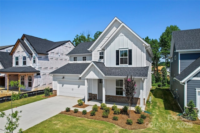 9511 Coast Laurel Ave NW, Concord, NC 28027 - view of front of house with board and batten siding, a porch, driveway, and a front lawn