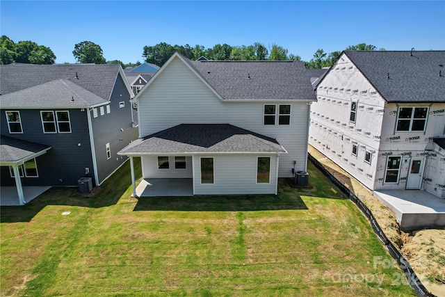 9511 Coast Laurel Ave NW, Concord, NC 28027 - rear view of property with a patio, a yard, and a shingled roof