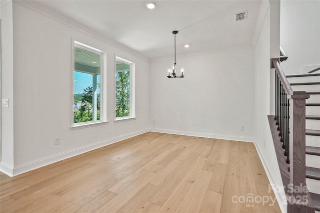 9511 Coast Laurel Ave NW, Concord, NC 28027 - unfurnished dining area with light wood-type flooring, stairway, a chandelier, recessed lighting, and crown molding