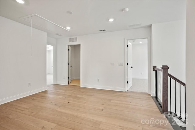 9511 Coast Laurel Ave NW, Concord, NC 28027 - spare room featuring attic access, light wood-style floors, recessed lighting, and a smoke detector