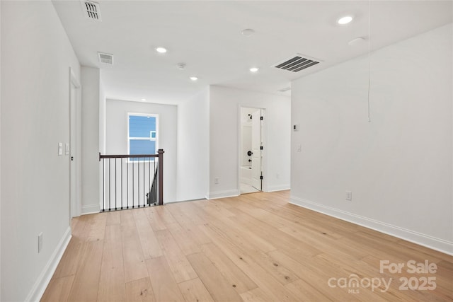 9511 Coast Laurel Ave NW, Concord, NC 28027 - spare room featuring light wood-type flooring, recessed lighting, and a smoke detector
