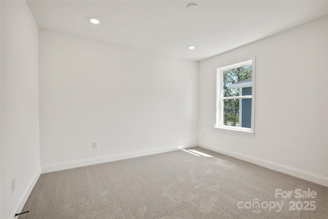 9511 Coast Laurel Ave NW, Concord, NC 28027 - carpeted spare room with baseboards and recessed lighting