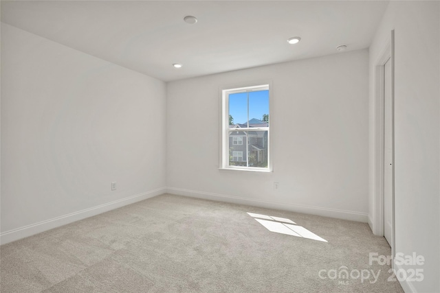 9511 Coast Laurel Ave NW, Concord, NC 28027 - spare room featuring light carpet and recessed lighting
