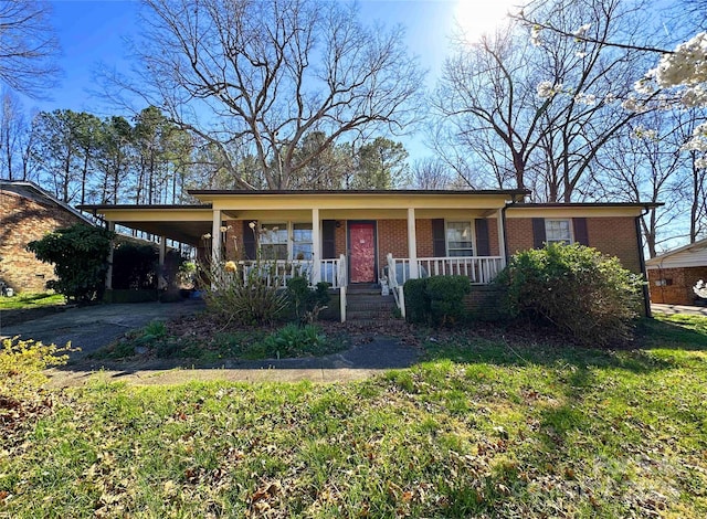 502 Monroe St, Shelby, NC 28150 - ranch-style home with brick siding, driveway, an attached carport, and covered porch
