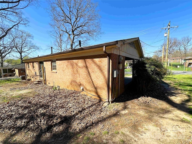 502 Monroe St, Shelby, NC 28150 - view of property exterior featuring brick siding and a central AC unit