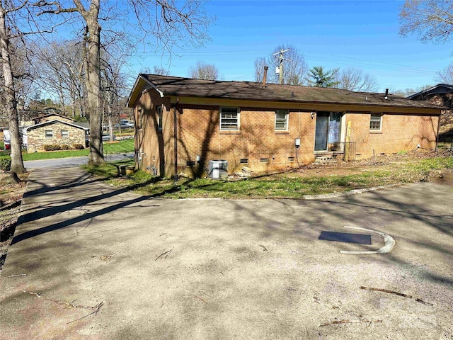 502 Monroe St, Shelby, NC 28150 - back of house featuring asphalt driveway, crawl space, and brick siding