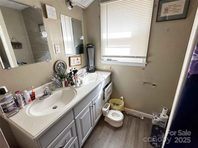 502 Monroe St, Shelby, NC 28150 - full bathroom featuring double vanity and wood finished floors