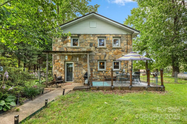 1058 Howard Gap Loop Rd, Flat Rock, NC 28731 - back of house featuring stone siding