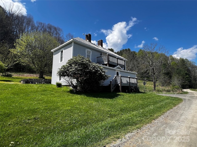 4606 Garvey Bridge Rd, Crumpler, NC 28617 - view of side of property with a chimney, a yard, a balcony, and a deck