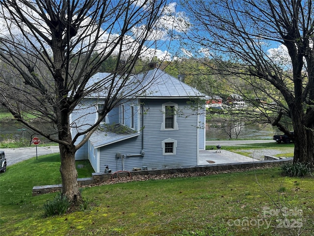 4606 Garvey Bridge Rd, Crumpler, NC 28617 - view of home's exterior featuring a lawn