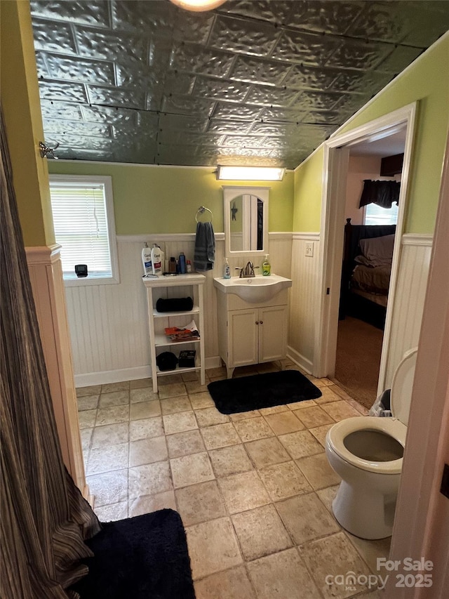 4606 Garvey Bridge Rd, Crumpler, NC 28617 - bathroom featuring a wainscoted wall, an ornate ceiling, vanity, and connected bathroom