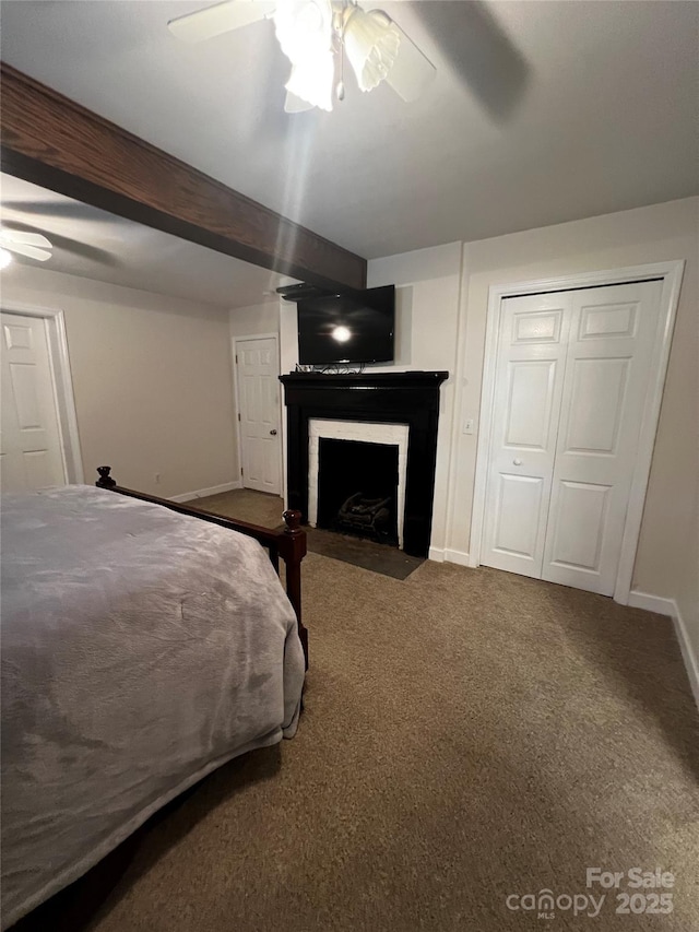 4606 Garvey Bridge Rd, Crumpler, NC 28617 - bedroom featuring a fireplace with flush hearth, carpet flooring, and a ceiling fan