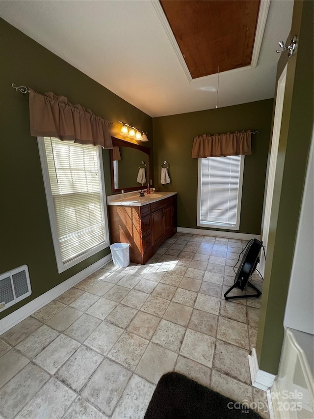 4606 Garvey Bridge Rd, Crumpler, NC 28617 - bathroom featuring plenty of natural light, vanity, stone tile floors, and a raised ceiling
