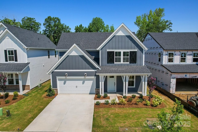 9515 Coast Laurel Ave NW, Concord, NC 28027 - view of front facade with board and batten siding, a porch, concrete driveway, and a front yard