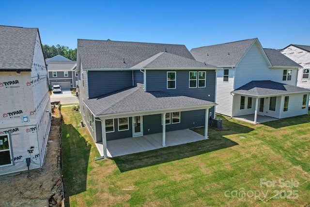9515 Coast Laurel Ave NW, Concord, NC 28027 - rear view of property featuring a shingled roof, a patio, and a yard
