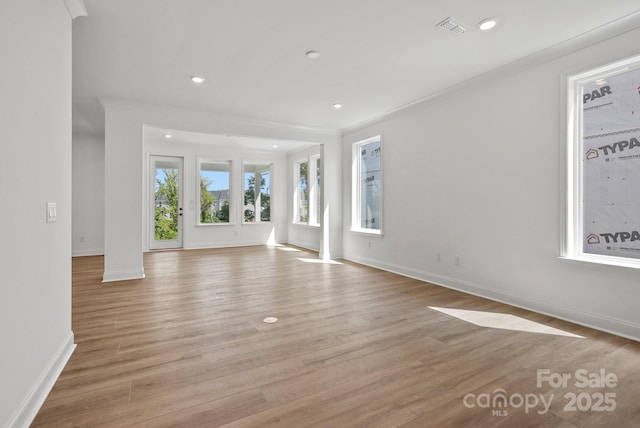 9515 Coast Laurel Ave NW, Concord, NC 28027 - unfurnished living room with recessed lighting and light wood-style floors