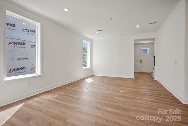 9515 Coast Laurel Ave NW, Concord, NC 28027 - empty room featuring recessed lighting, light wood-type flooring, and ornamental molding