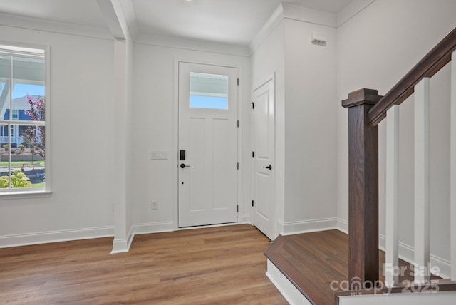 9515 Coast Laurel Ave NW, Concord, NC 28027 - foyer entrance featuring plenty of natural light, light wood-style floors, and ornamental molding