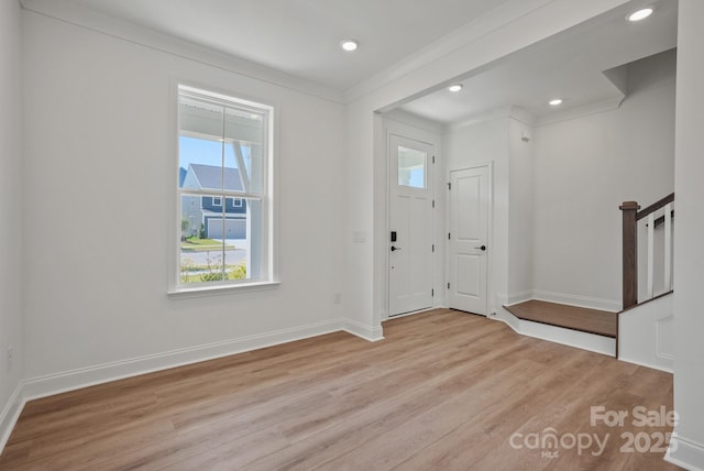 9515 Coast Laurel Ave NW, Concord, NC 28027 - foyer entrance with wood finished floors, recessed lighting, and ornamental molding