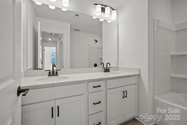 9515 Coast Laurel Ave NW, Concord, NC 28027 - bathroom with double vanity and shower / bath combination