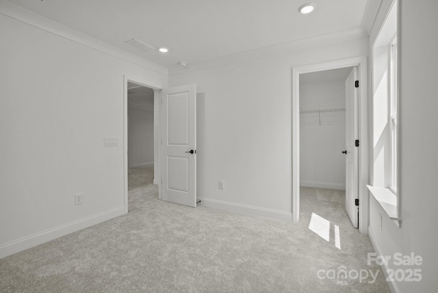 9515 Coast Laurel Ave NW, Concord, NC 28027 - unfurnished bedroom with a walk in closet, carpet flooring, recessed lighting, and a closet