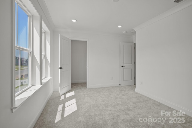 9515 Coast Laurel Ave NW, Concord, NC 28027 - empty room featuring light carpet, crown molding, and recessed lighting