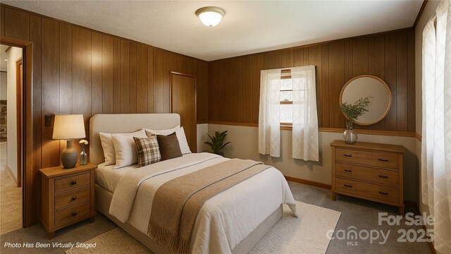 560 Bailey Mountain Rd, Mars Hill, NC 28754 - bedroom with wooden walls and light carpet