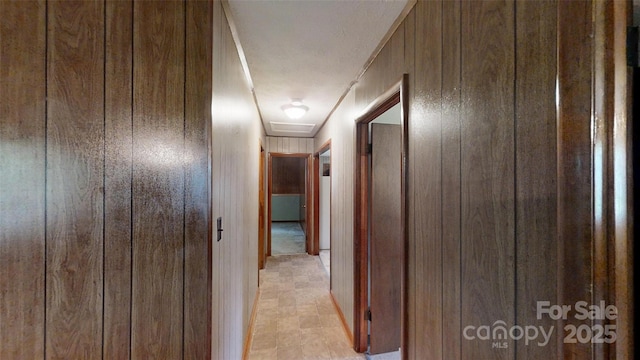 560 Bailey Mountain Rd, Mars Hill, NC 28754 - hallway featuring wood walls and attic access