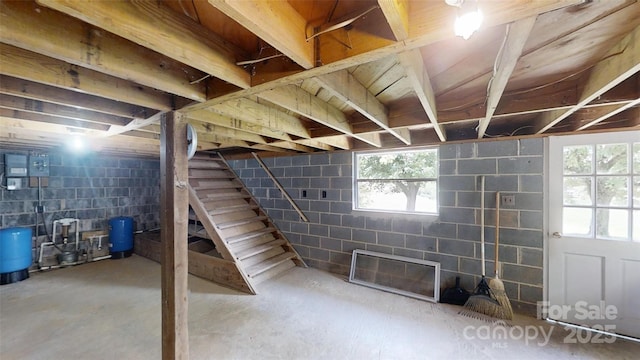 560 Bailey Mountain Rd, Mars Hill, NC 28754 - below grade area featuring a water pressure tank, concrete block wall, and stairs