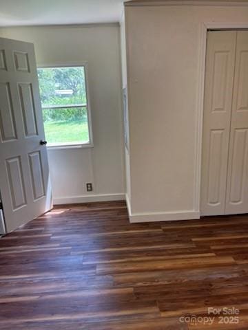 155 Calico Ln, Mooresboro, NC 28114 - unfurnished bedroom with dark wood-type flooring and a closet