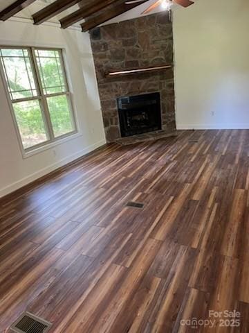 155 Calico Ln, Mooresboro, NC 28114 - unfurnished living room featuring ceiling fan, a fireplace, beamed ceiling, and wood finished floors