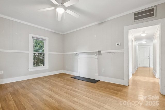 709 E Front St, Statesville, NC 28677 - unfurnished living room with ornamental molding, wood finished floors, and ceiling fan