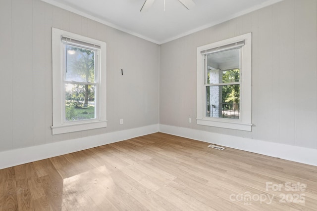 709 E Front St, Statesville, NC 28677 - spare room with crown molding, wood finished floors, and wooden walls